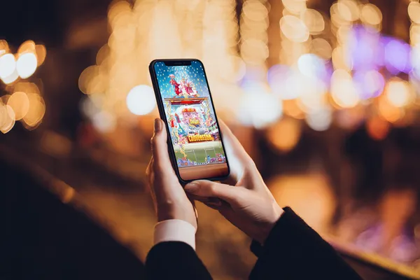 A dramatic shot of winning sevens landing on a slot reel surrounded by shining gold coins, symbolizing big wins.